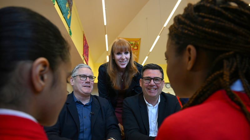 Britain's Prime Minister Keir Starmer, MP and former deputy prime minister, Angela Rayner and Manchester mayor Mr Burnham in Ashton-under-Lyne, Greater Manchester, in April
