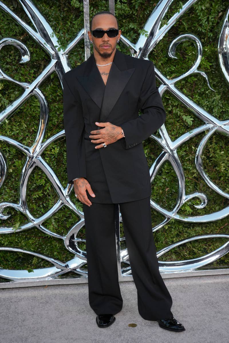 One of the evening’s co-chairs, Lewis Hamilton, goes all black in Saint Laurent, with longtime stylist Eric McNeal behind the look.