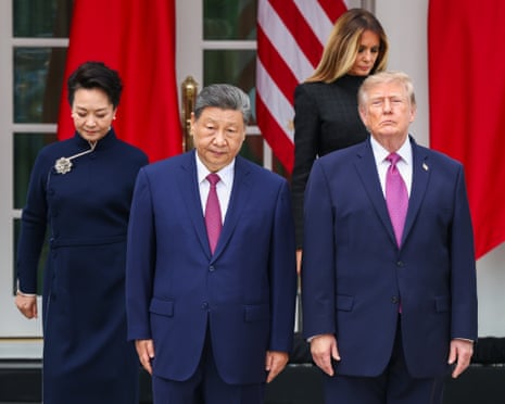 two men and two women stand outside