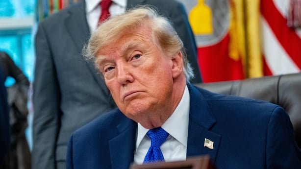 US President Donald Trump sits in the Oval Office