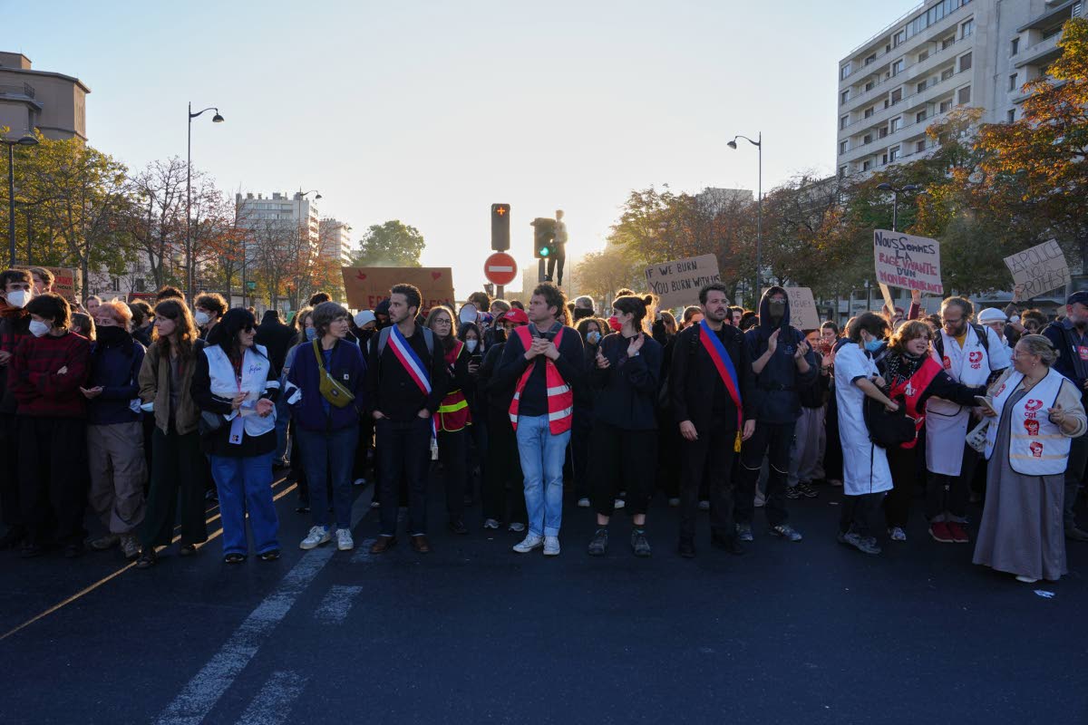 Students gather on the street before a demonstration against under-resourced schools, in Paris, Tuesday, Oct. 6, 2026. (AP Photo/Aurelien Morissard)