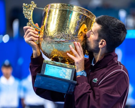 Novak Djokovic of Serbia poses with the trophy at the China Open in Beijing.