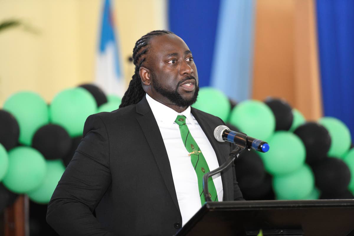 Dr Jermaine McCalpin, representing the Calabar Old Boys Association, delivers a tribute at the funeral.